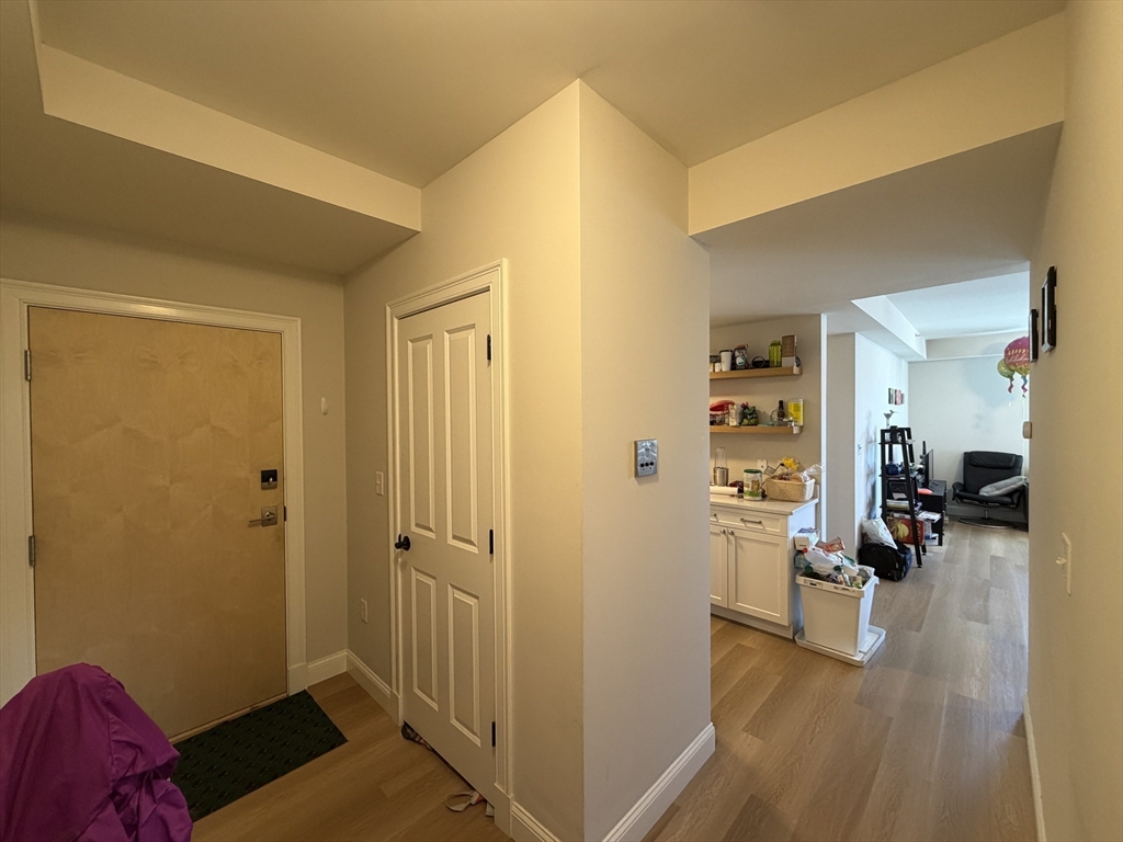 43 Pitman Street, Unit 302 Somerville, MA 02143 - Photo 5 of 14 a view of a livingroom with furniture and hardwood floor
