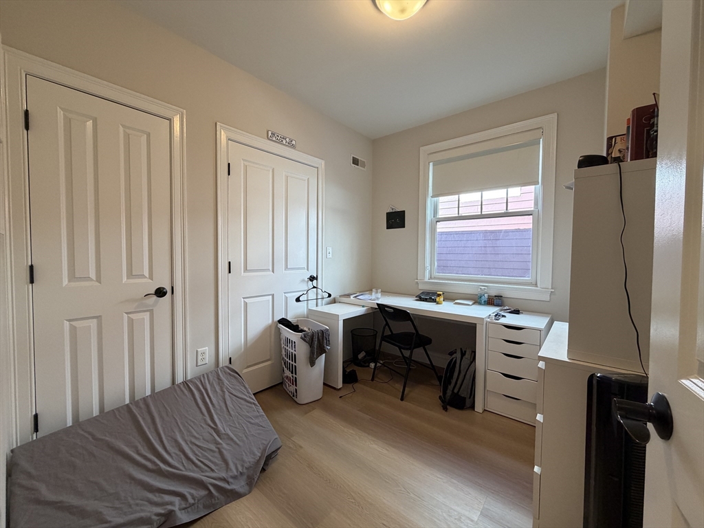 43 Pitman Street, Unit 302 Somerville, MA 02143 - Photo 6 of 14 a view of a workspace with furniture and a window