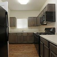 2790 Rodeo Road Abbeville, LA 70510 - Photo 4 of 6 a kitchen with stainless steel appliances granite countertop a stove a sink and a refrigerator