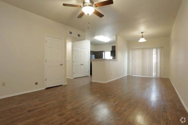 2790 Rodeo Road Abbeville, LA 70510 - Photo 6 of 6 an empty room with wooden floor and windows