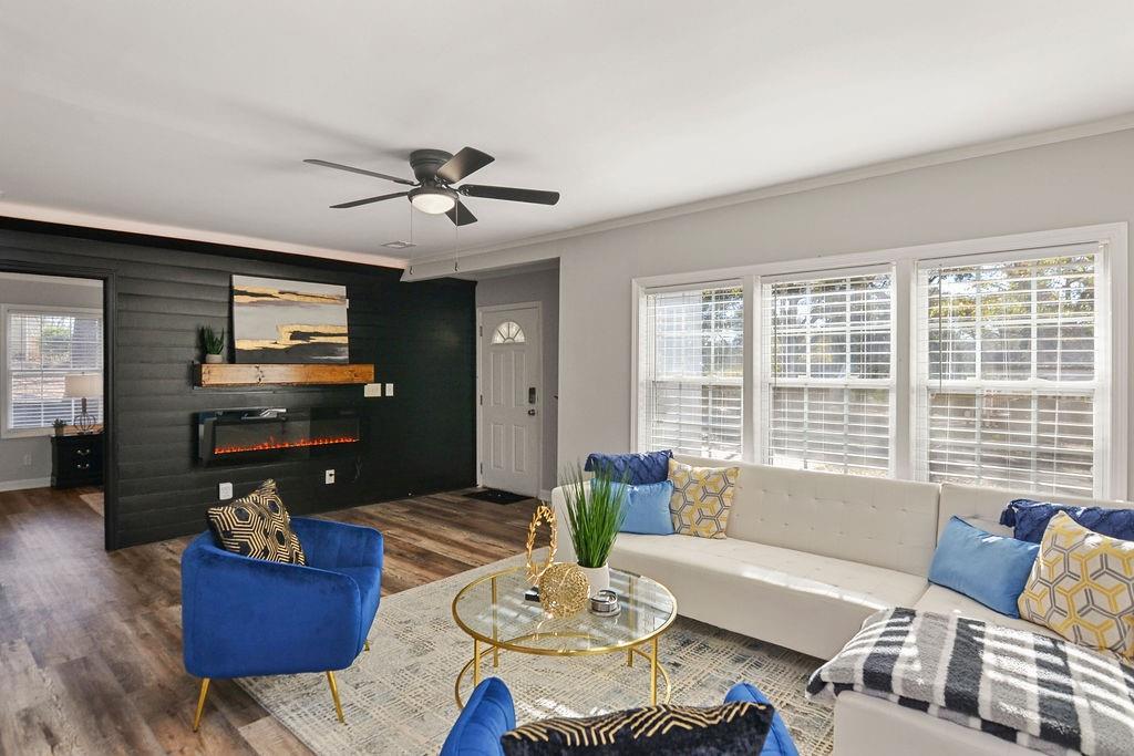 1917 Spring Avenue Atlanta, GA 30344 - Photo 2 of 22 a living room with furniture and a flat screen tv