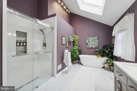 a potted plant sitting in front of a bathroom