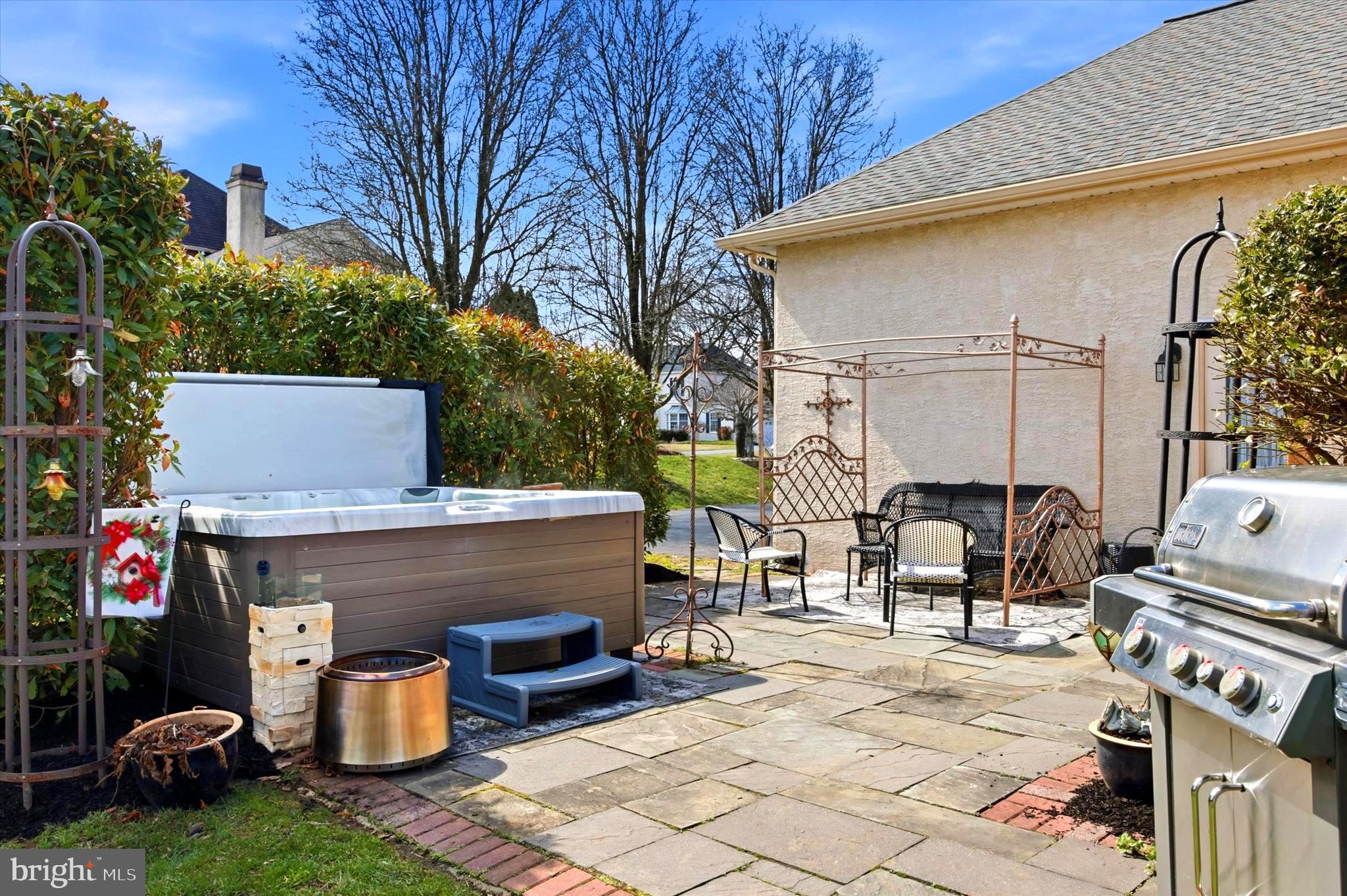 22 Country Run Thornton, PA 19373 - Photo 27 of 32 Slate patio with a hot tub