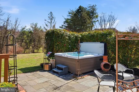 a view of a backyard with sitting area