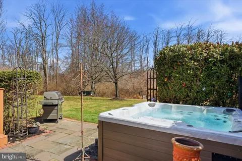 a view of a backyard with wooden fence