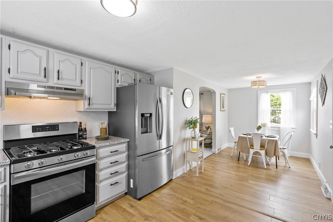 6130 South Bay Road Cicero, NY 13039 - Photo 9 of 30 And now we step back into the kitchen to see this long, open space that will make gatherings a cinch!