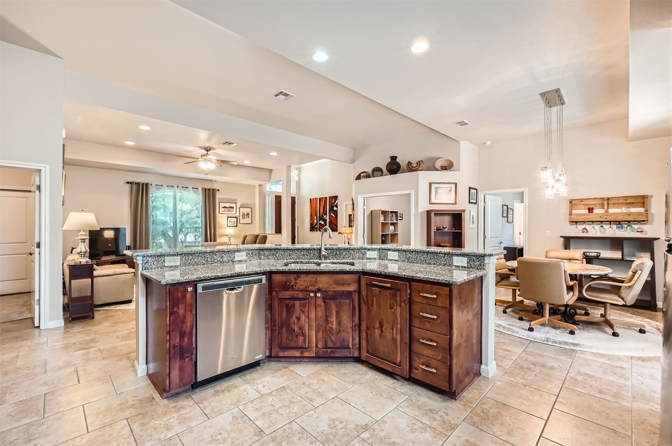 5501 Hitching Post Lago Vista, TX 78645 - Photo 26 of 26 a large kitchen with kitchen island a sink table and chairs
