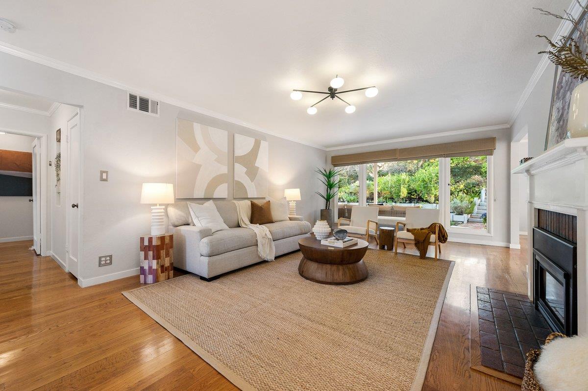 1277 Edgewood Road Redwood City, CA 94062 - Photo 13 of 49 a living room with furniture fireplace and a large window