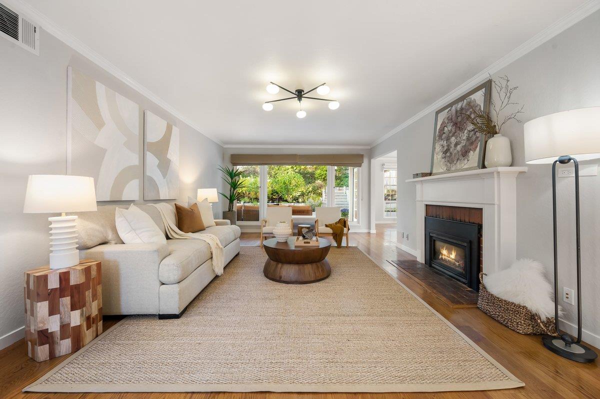 1277 Edgewood Road Redwood City, CA 94062 - Photo 14 of 49 a living room with furniture and a fireplace