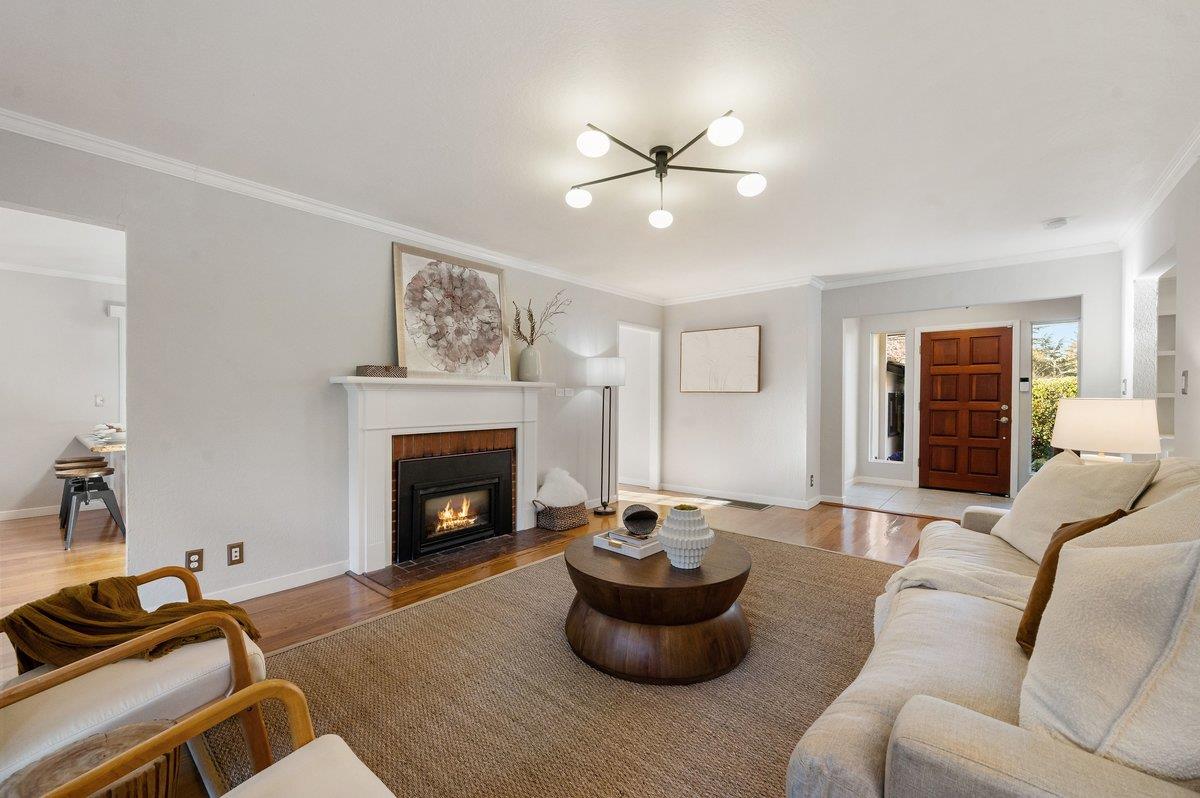 1277 Edgewood Road Redwood City, CA 94062 - Photo 16 of 49 a living room with furniture and a fireplace