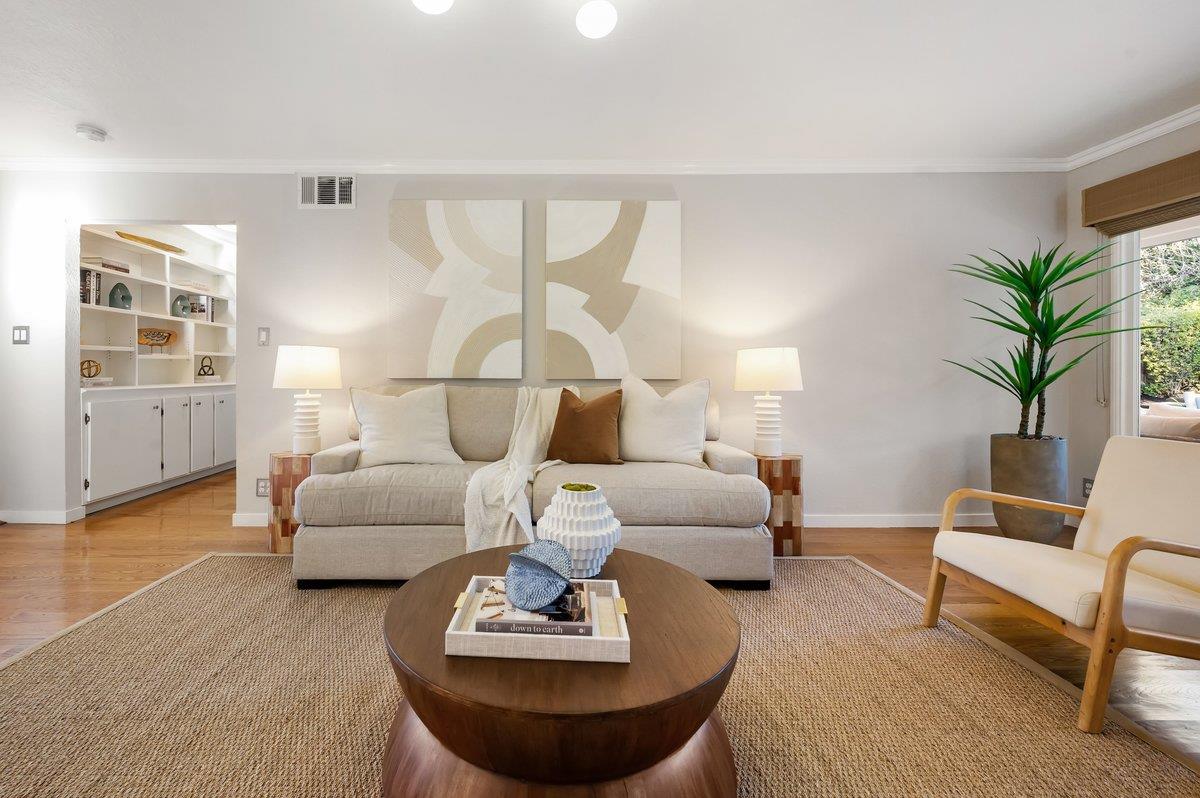 1277 Edgewood Road Redwood City, CA 94062 - Photo 17 of 49 a living room with furniture and wooden floor