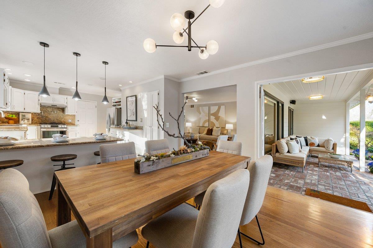 1277 Edgewood Road Redwood City, CA 94062 - Photo 18 of 49 a room with stainless steel appliances kitchen island granite countertop furniture and a kitchen view