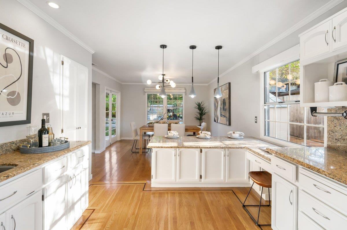 1277 Edgewood Road Redwood City, CA 94062 - Photo 25 of 49 a kitchen with granite countertop a sink cabinets and wooden floor