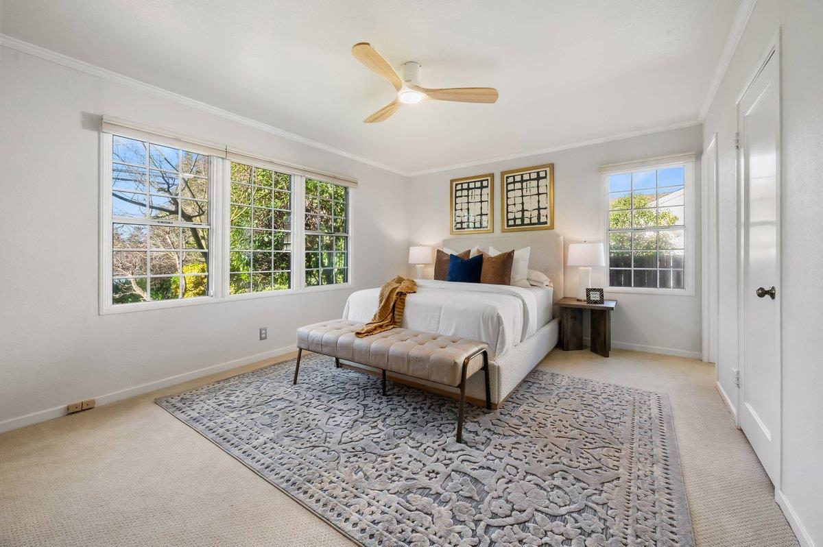 1277 Edgewood Road Redwood City, CA 94062 - Photo 27 of 49 a living room with a bed furniture and a window