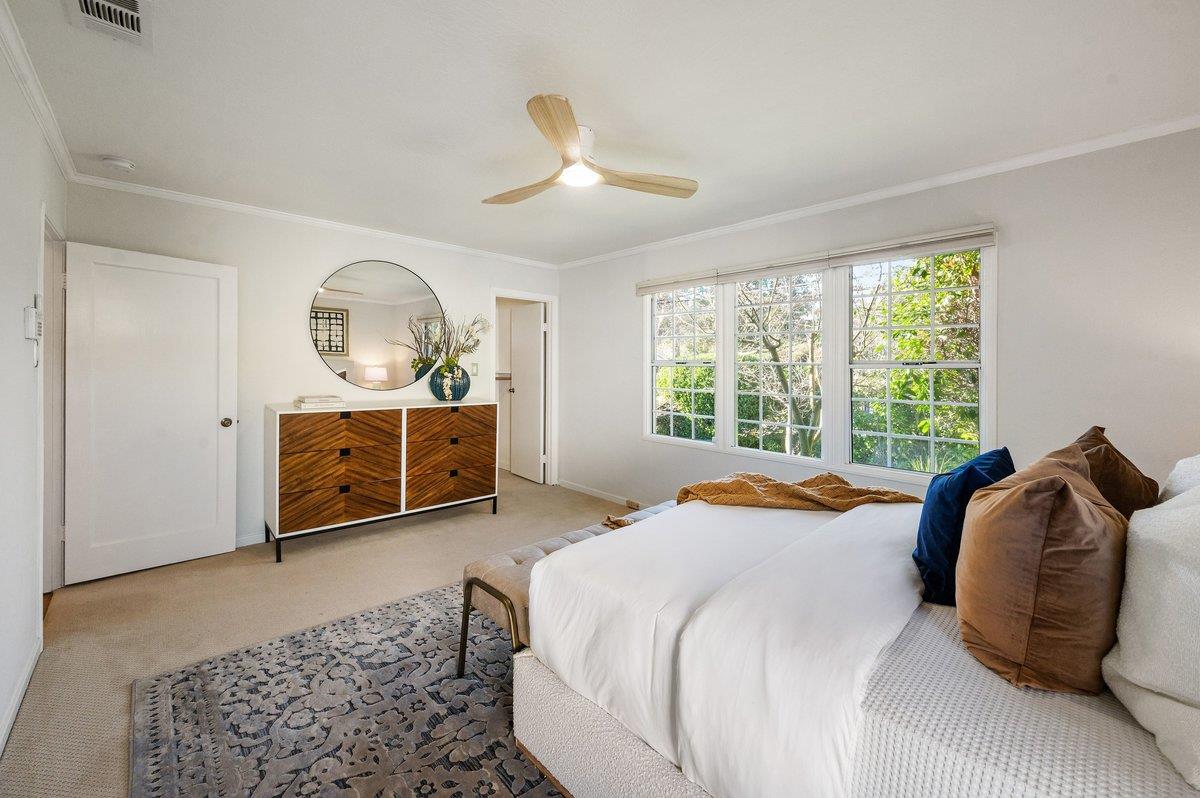 1277 Edgewood Road Redwood City, CA 94062 - Photo 28 of 49 a bedroom with a bed dresser and a window