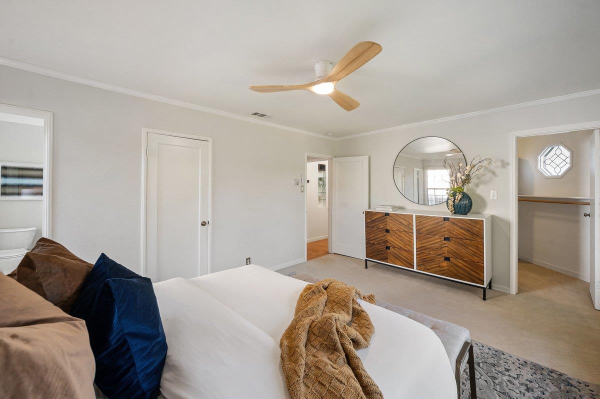 1277 Edgewood Road Redwood City, CA 94062 - Photo 29 of 49 a bed room with a bed and a mirror
