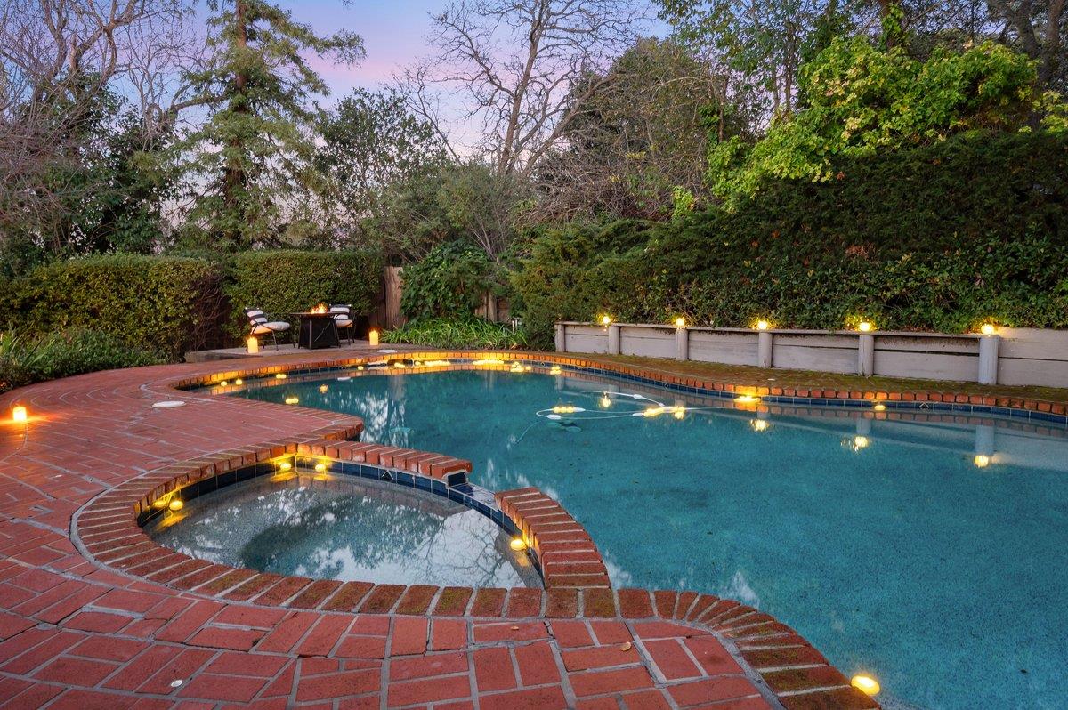 1277 Edgewood Road Redwood City, CA 94062 - Photo 3 of 49 a view of a swimming pool with a yard
