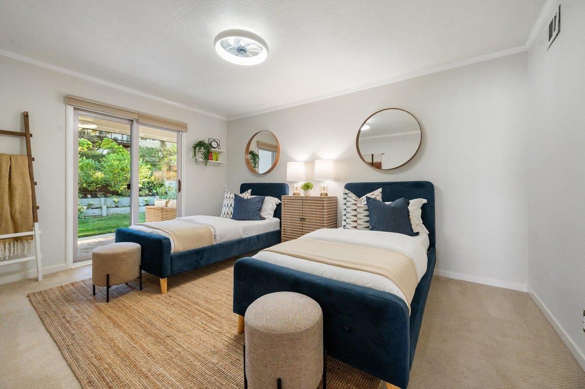 1277 Edgewood Road Redwood City, CA 94062 - Photo 32 of 49 a bedroom with bed and wooden floor