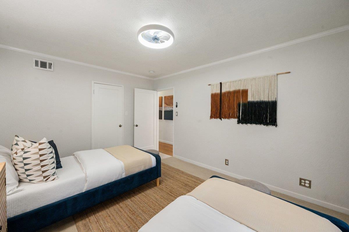 1277 Edgewood Road Redwood City, CA 94062 - Photo 33 of 49 a bedroom with a bed and window