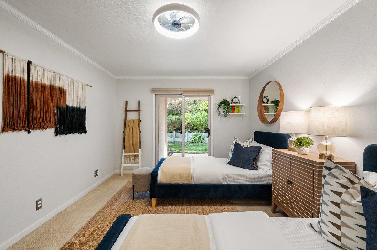 1277 Edgewood Road Redwood City, CA 94062 - Photo 34 of 49 a bedroom with a bed window and a flat screen tv