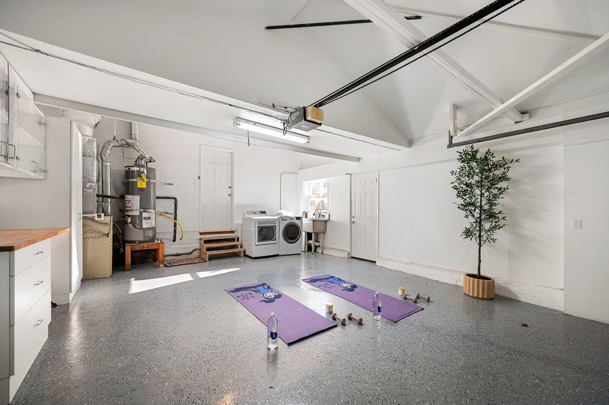 1277 Edgewood Road Redwood City, CA 94062 - Photo 37 of 49 a living room with furniture and potted plant