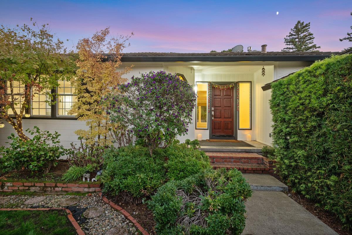 1277 Edgewood Road Redwood City, CA 94062 - Photo 38 of 49 a front view of a house with a yard and garage