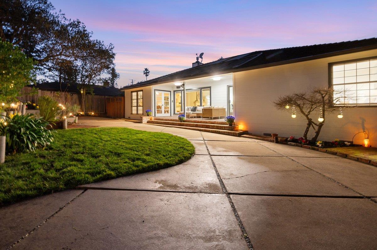 1277 Edgewood Road Redwood City, CA 94062 - Photo 4 of 49 a front view of a house with a yard and potted plants