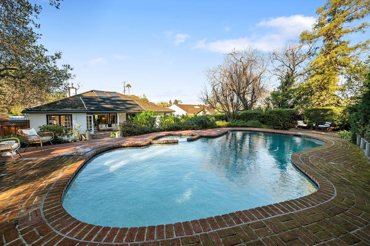 1277 Edgewood Road Redwood City, CA 94062 - Photo 44 of 49 a view of swimming pool with outdoor seating