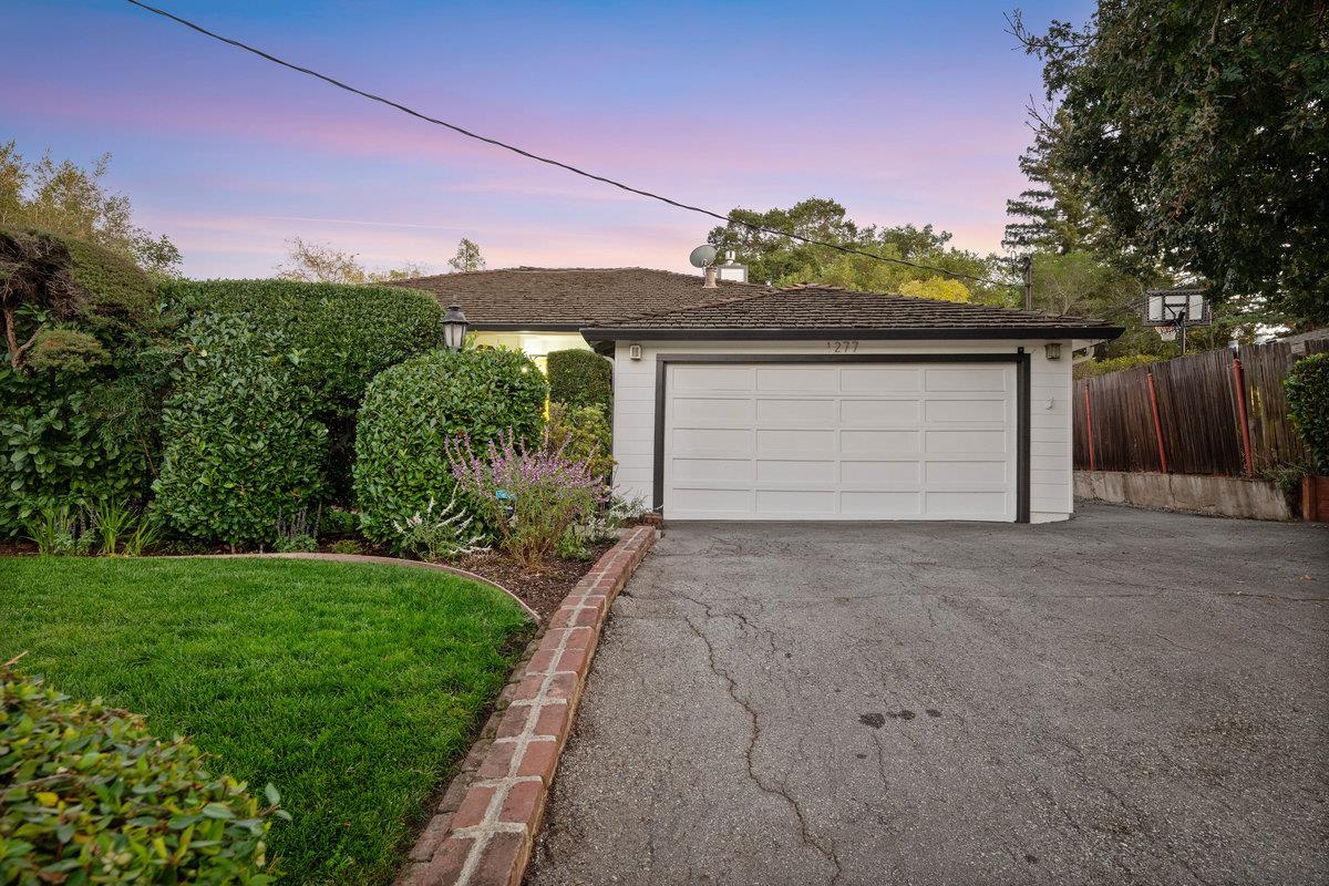 1277 Edgewood Road Redwood City, CA 94062 - Photo 47 of 49 a front view of a house with a yard and garage