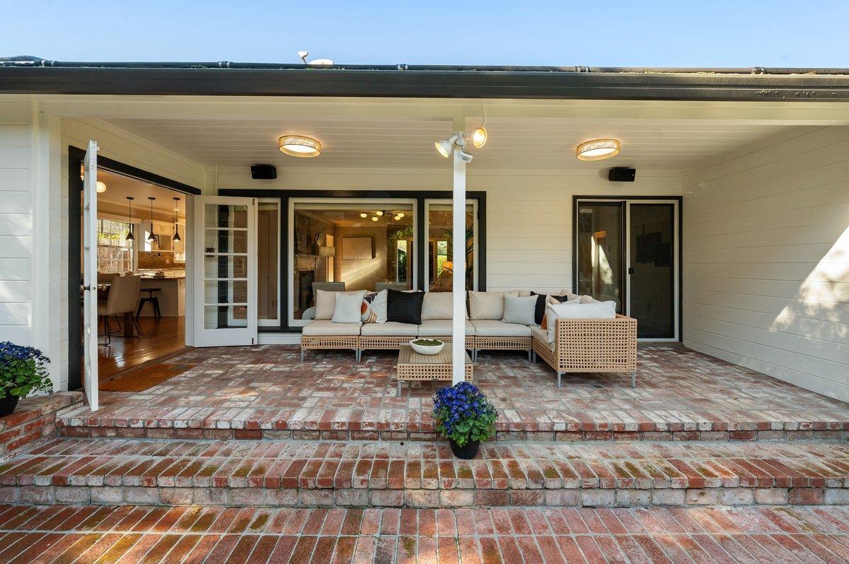 1277 Edgewood Road Redwood City, CA 94062 - Photo 8 of 49 a living room with furniture and a fireplace
