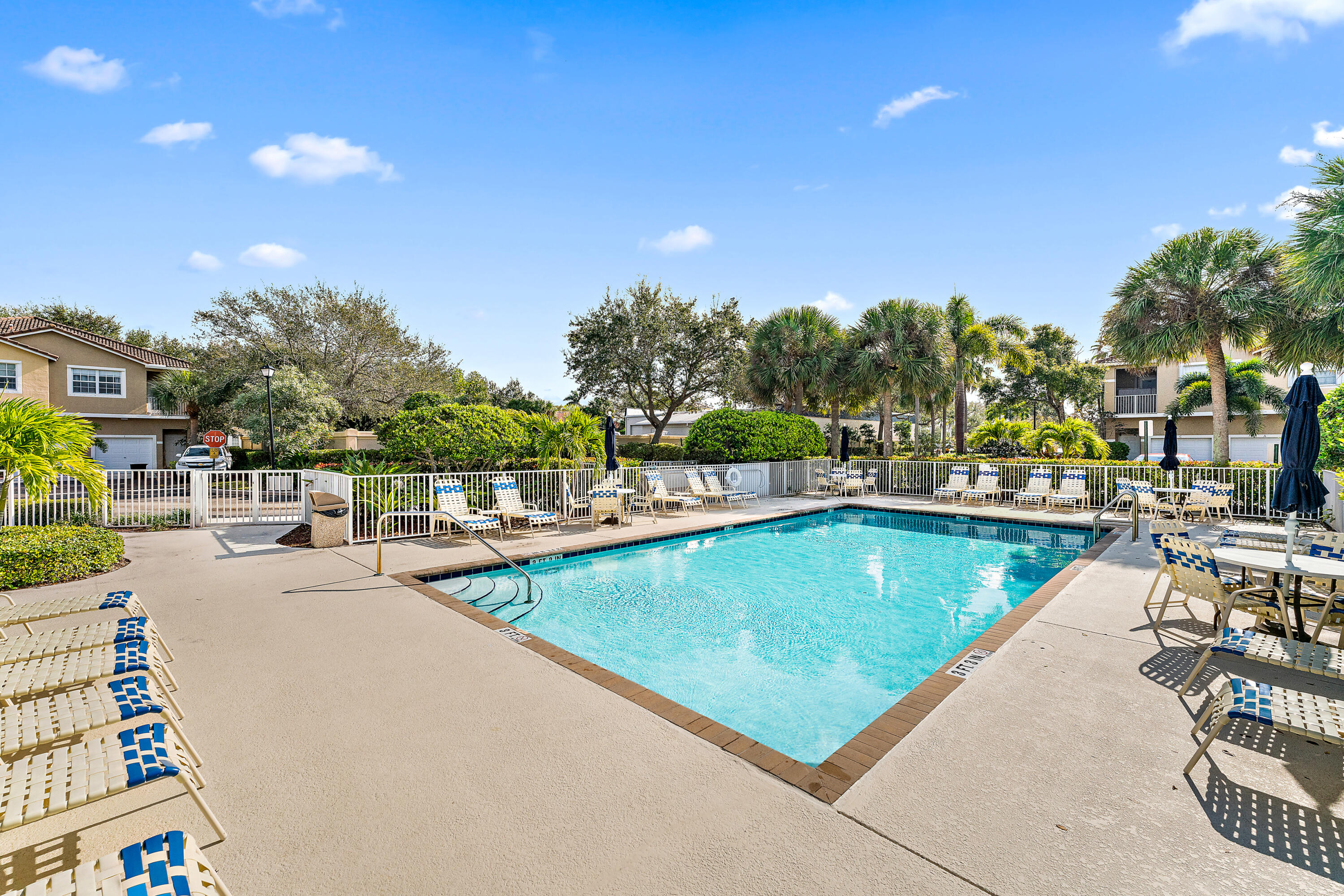 106 Lighthouse Circle, Unit G Tequesta, FL 33469 - Photo 3 of 35 a view of a swimming pool with outdoor seating