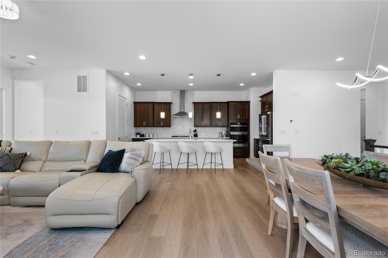 6610 Fawn Path Lane Castle Pines, CO 80108 - Photo 14 of 50 a living room with furniture and view of kitchen