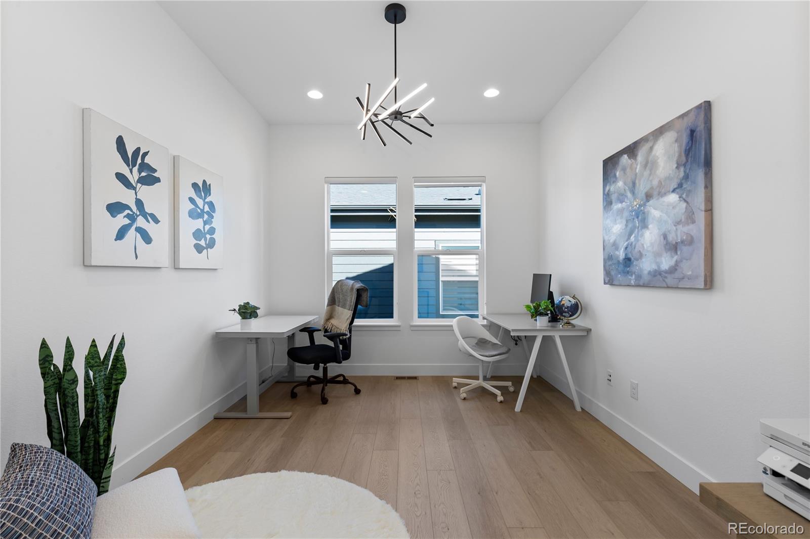 6610 Fawn Path Lane Castle Pines, CO 80108 - Photo 21 of 50 a living room with furniture and a large window