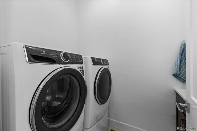 a bedroom with a bed and chair