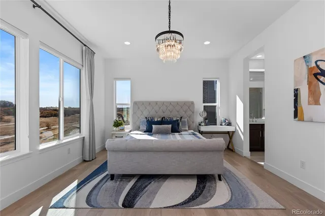 a bedroom with bed and a window