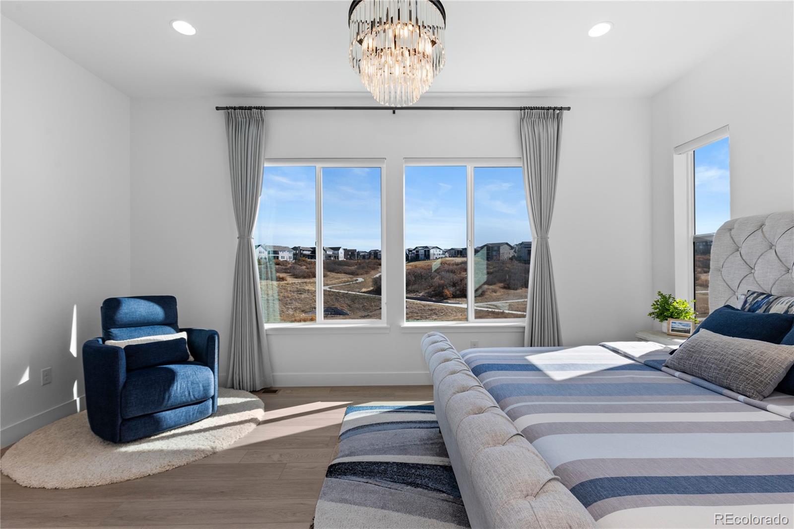 6610 Fawn Path Lane Castle Pines, CO 80108 - Photo 28 of 50 a bedroom with bed and a window