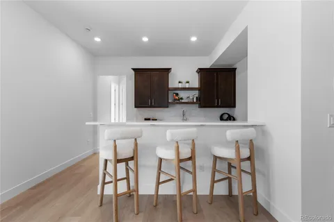 a view of dining room with furniture and wooden floor