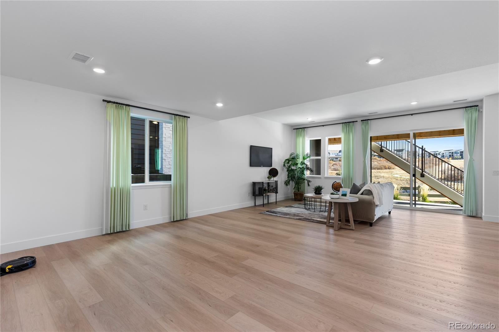6610 Fawn Path Lane Castle Pines, CO 80108 - Photo 34 of 50 a view of dining room with furniture and wooden floor