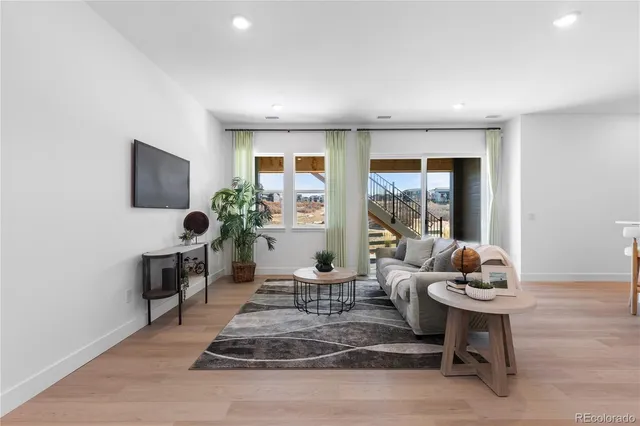 a view of a livingroom with wooden floor