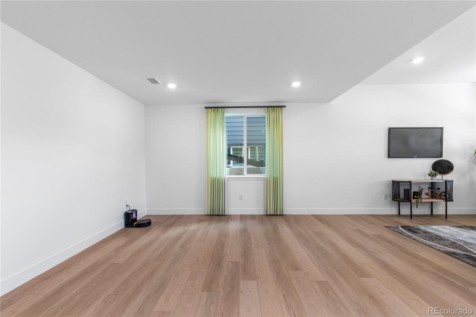 6610 Fawn Path Lane Castle Pines, CO 80108 - Photo 36 of 50 a view of a livingroom with wooden floor
