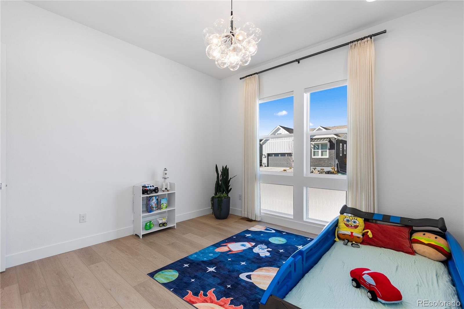 6610 Fawn Path Lane Castle Pines, CO 80108 - Photo 40 of 50 a room with toys and wooden floor