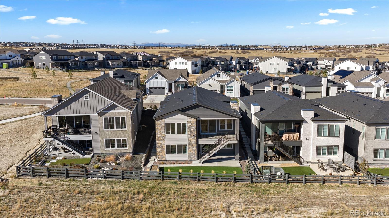 6610 Fawn Path Lane Castle Pines, CO 80108 - Photo 47 of 50 front view of a house with a yard