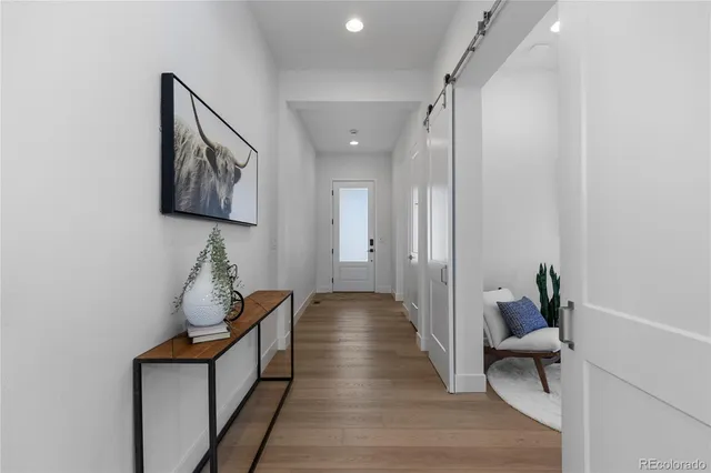 a view of hallway with furniture