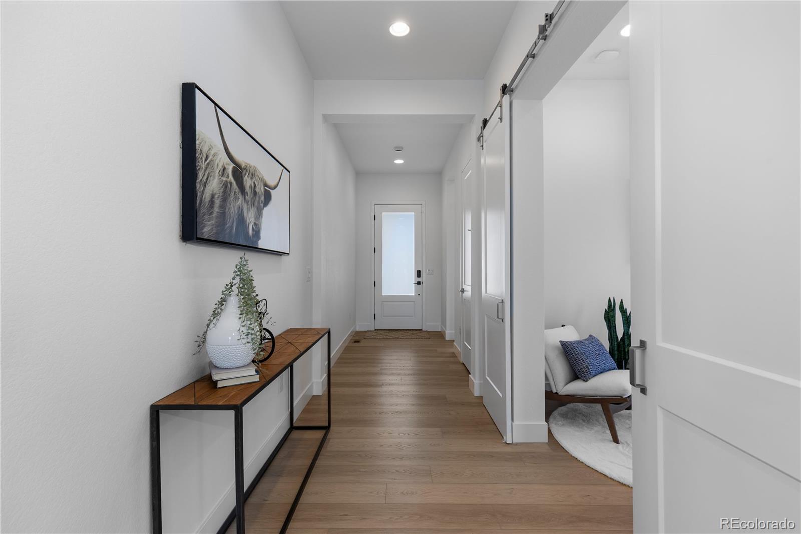 6610 Fawn Path Lane Castle Pines, CO 80108 - Photo 6 of 50 a view of hallway with furniture