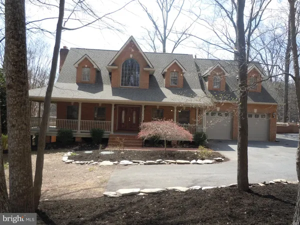a front view of a house with yard