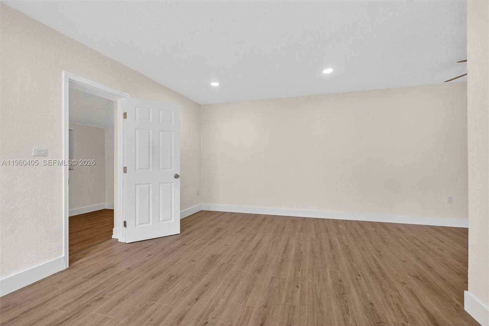 280 Northwest 34th Street Miami, FL 33127 - Photo 15 of 34 a view of an empty room with wooden floor