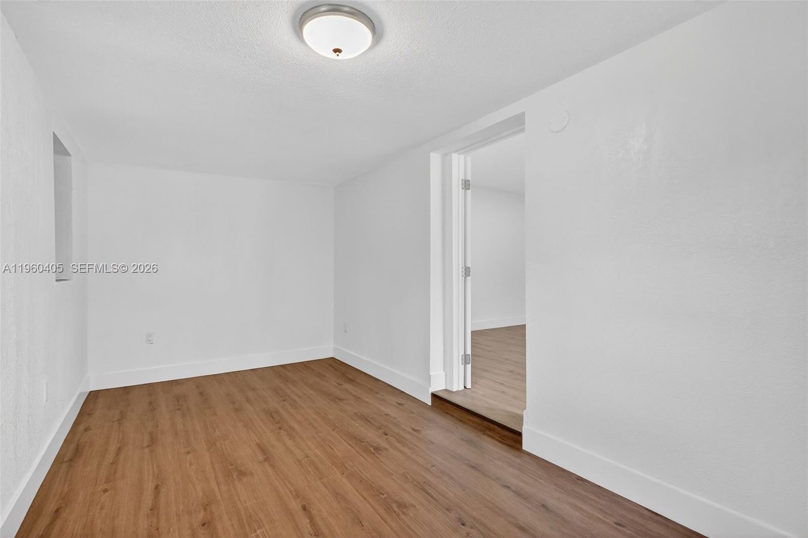 280 Northwest 34th Street Miami, FL 33127 - Photo 16 of 34 a view of a room with wooden floor