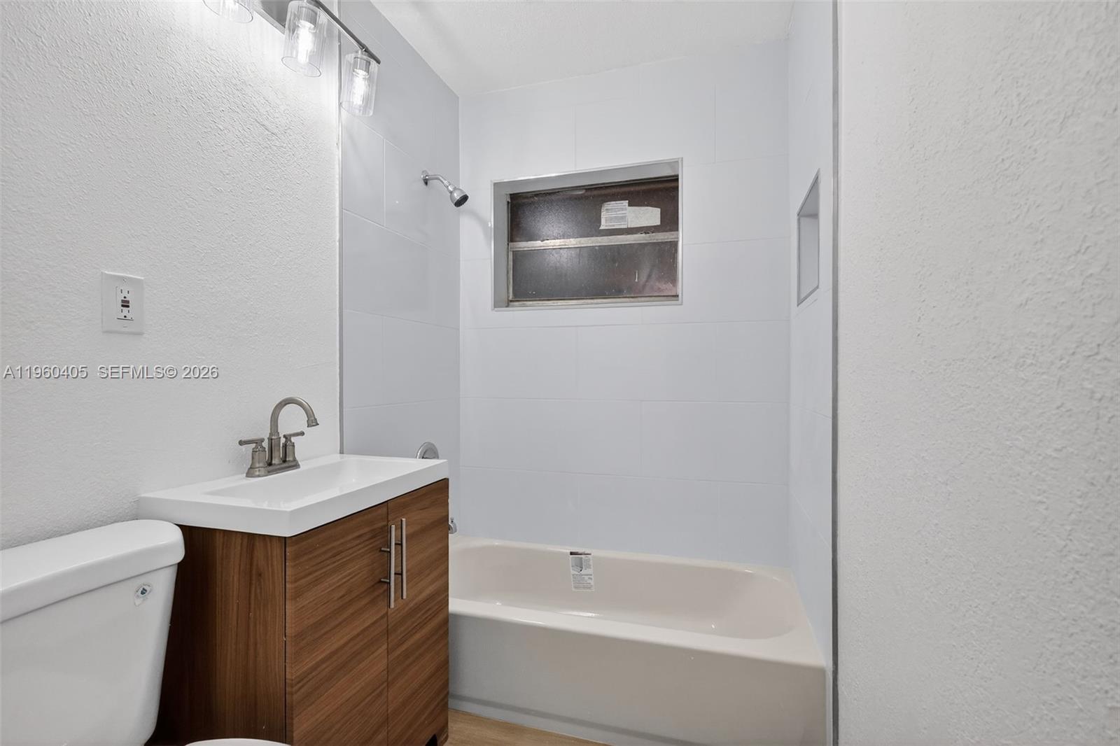 280 Northwest 34th Street Miami, FL 33127 - Photo 19 of 34 a bathroom with a sink toilet and shower