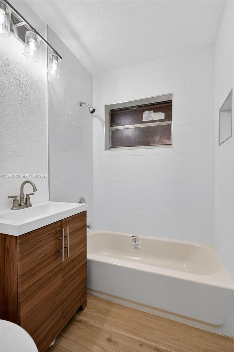 280 Northwest 34th Street Miami, FL 33127 - Photo 20 of 34 a bathroom with a bathtub and a sink