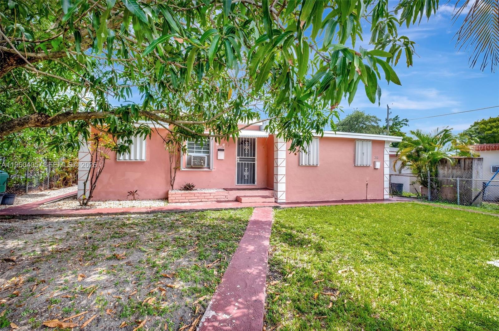 280 Northwest 34th Street Miami, FL 33127 - Photo 29 of 34 a front view of a house with garden